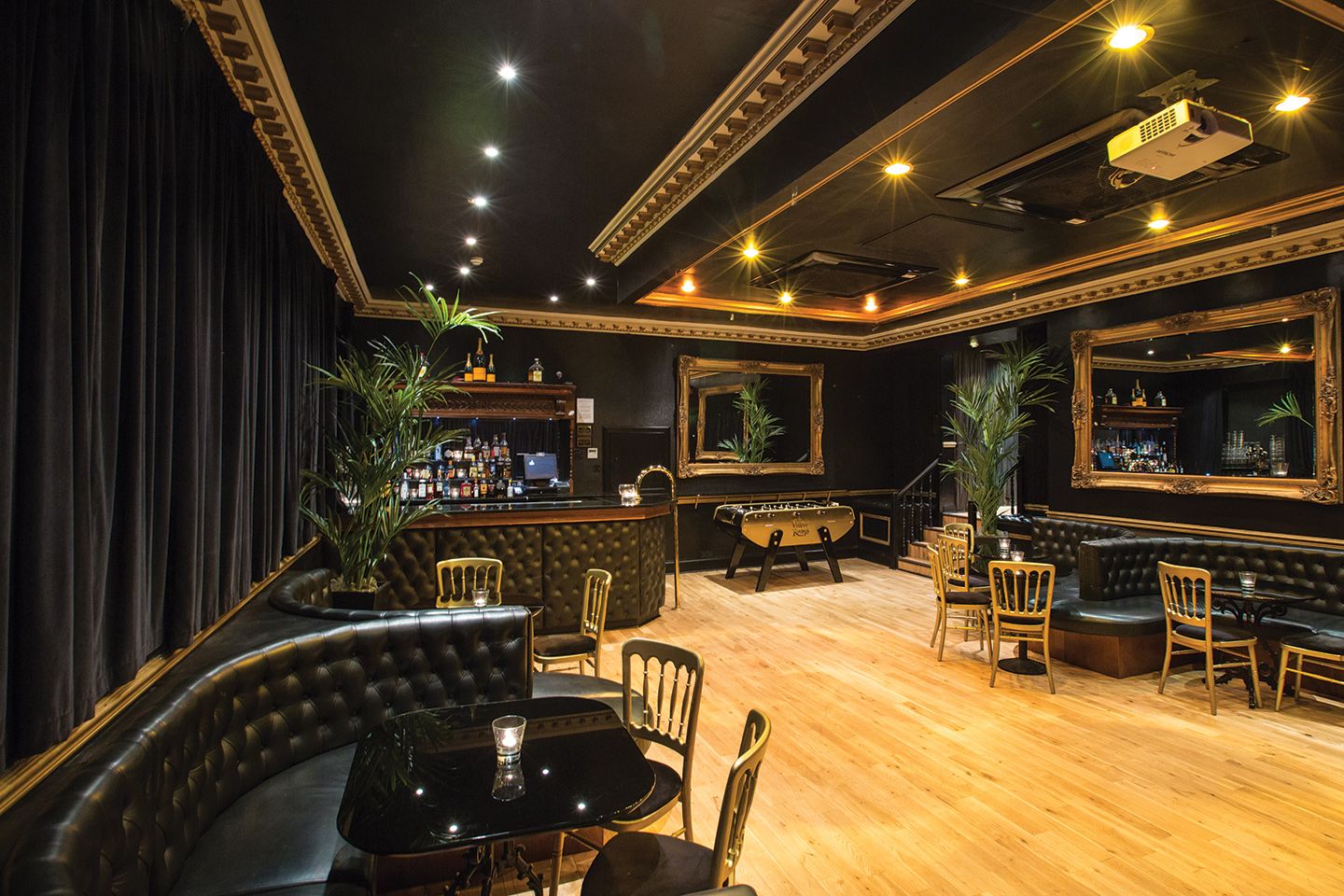 Elegant lounge with dark decor.